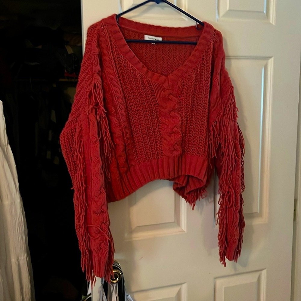 Burnt orange short sweater w long fringe sleeves. Size XL